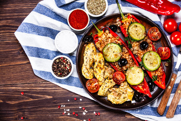 Pepper stuffed with groats and vegetables and grilled chicken strips