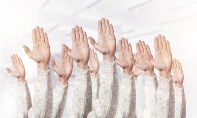 Row of man hands showing voting gesture