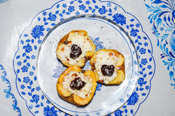 Apples baked with cottage cheese and decorated with chocolate and coconut chips.