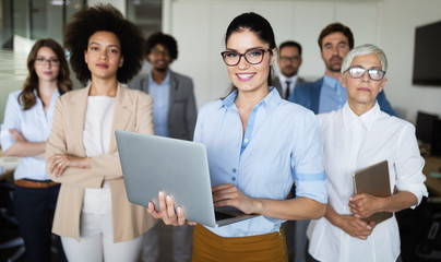 Group of successful business people in office