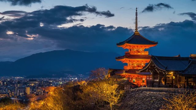 Time lapse of Kyoto city with red pagoda at twilight, Japan. zoom out