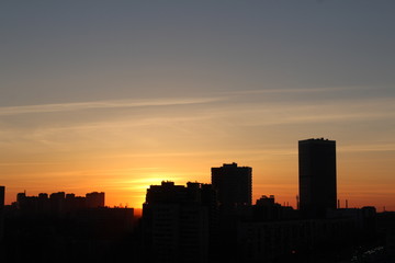 Obraz na płótnie Canvas sunset over city