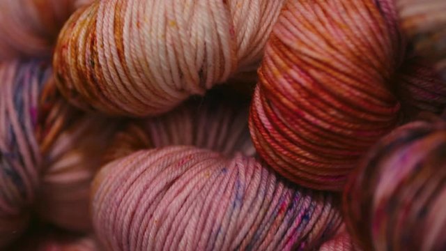 Macro close up of rolled up yarn on a shelf