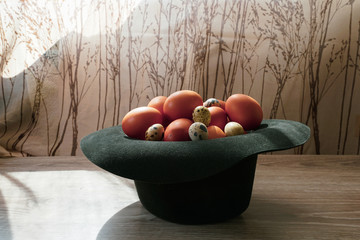 Easter gift - a hat full of eggs. The hat laid chicken and quail eggs
