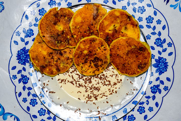 Cheesecakes with sour cream and chocolate chips on plate.