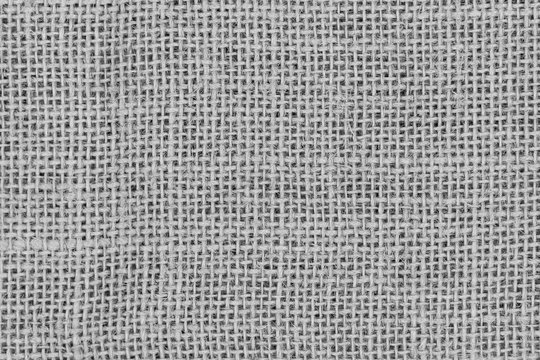 White burlap woven texture seamless. grey jute background close up macro
