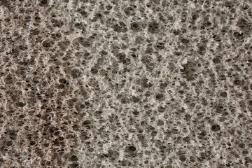 Obraz premium Macro of grey abrasive sponge work item isolated