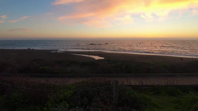 Fast time lapse hyperlapse of a colorful sunset over the Pacific Ocean at Moonstone Beach Park in Cambria California