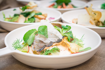 Fresh Italian salad with fish, pesto and lettuce