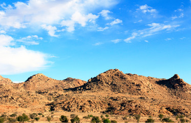 The bright blue sky above the mountains