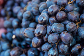 ripe juicy grapes close-up on the market showcase fresh harvest, selective focus