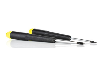 Group of two whole screwdrivers with a yellow black plastic handle work item isolated on white background