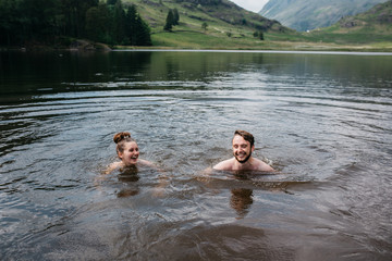 Couple swimming in a lake