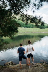 Couple enjoying the scenery in front of a landscape