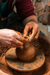 Potter at work. Workshop place.