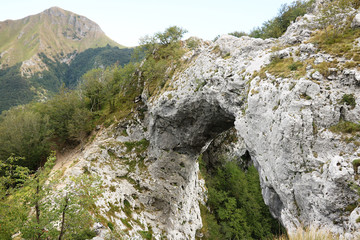 Fototapeta na wymiar Alpi Apuane, Forte dei Marmi, Lucca, Tuscany, Italy. Arch of the Passo del Monte Forato. The town is considered of Community-environmental interest by the EEC.