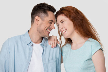 Happy young couple touch foreheads having fun together