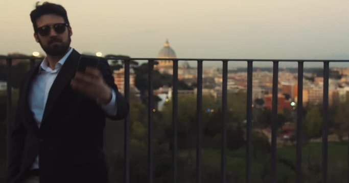 Walking down a street in Rome to take pictues and selfies of St. Peter's Basilica. The Basilica is one of the largest basilicas in the world and is located in Vatican City in Rome.