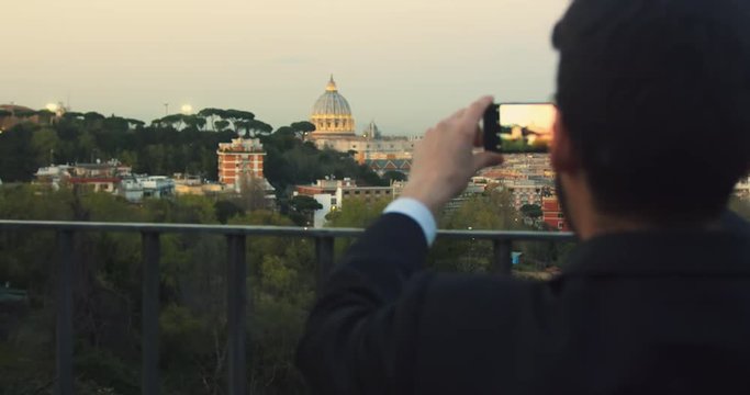 Walking down a street in Rome to take pictues and selfies of St. Peter's Basilica. The Basilica is one of the largest basilicas in the world and is located in Vatican City in Rome.