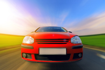 Fototapeta na wymiar car in motion / driving speed blurred background