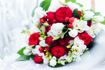 wedding bouquet of white and red roses. close up