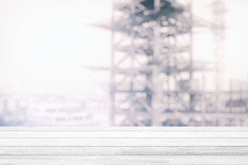 White Wood Table with Construction Background, Suitable for Product Display.