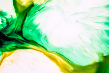 Background of green, yellow, blue ink waves