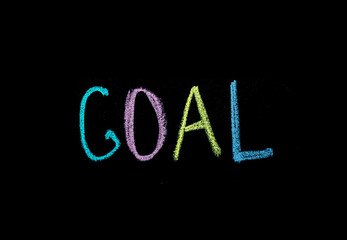 colored word "goal" on chalkboard