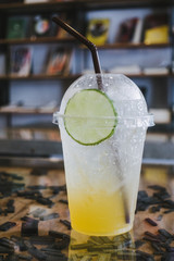 Honey lemon drink on the cafe table .