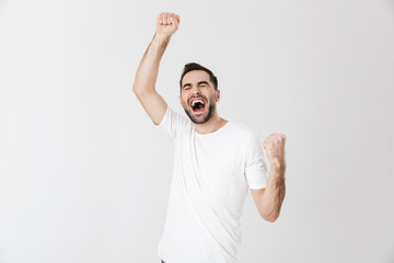 Fototapeta premium Handsome cheerful man wearing blank t-shirt