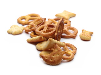 Salty cracker and pretzel snacks, party mix isolated on white background