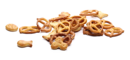 Salty cracker and pretzel snacks, party mix isolated on white background