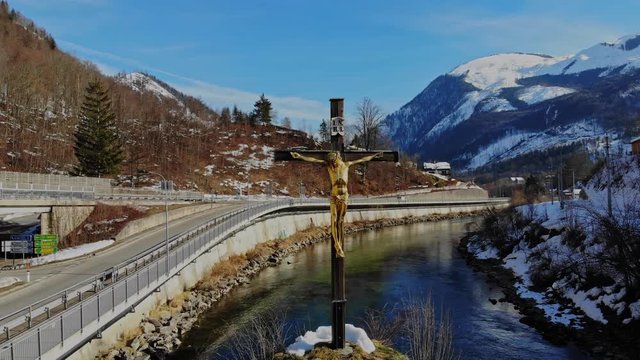 Holy cross with jesus in river Traun by Bad Ischl on a wonderfull winterday Location Salzkammergut