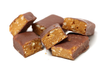 Chocolate peanut candy on white background