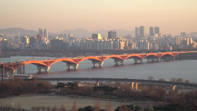Red Seongsan bridge on sunset in Seoul , shot from Hanul Park, Seoul City View