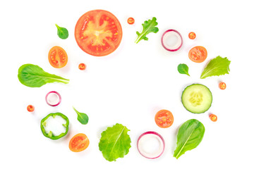 Fresh vegetable salad ingredients, shot from above on a white background. A flat lay composition with tomato, pepper, cucumber, onion slices and mezclun leaves, forming a frame with a place for text