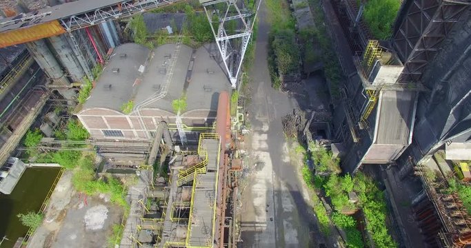 Abandoned coke (fuel) coal factory Carsid in Charleroi. Urbex location in Belgium, near La Providence train station. Drone footage of the ground.