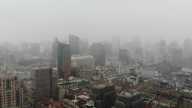 Mysterious, abandoned city vibe of the foggy Shanghai skyline.