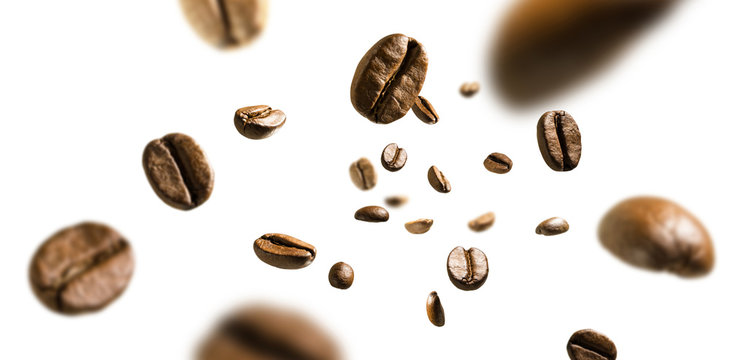 Coffee beans in flight on white background © butenkow