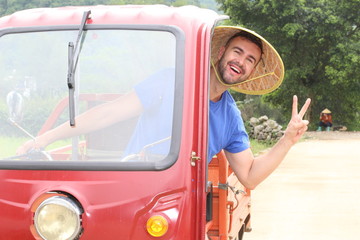 Tourist driving a tuk-tuk in Asia
