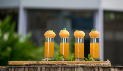 Pani Puri Shots : (a.k.a. golgappa shots or gol gappe shots) are a versatile snack invented in India made of stuffed pani puri (golgappa) placed on top of liquid-filled shot glasses. © Nitin