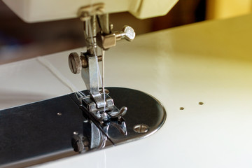 Part of an electric sewing machine.