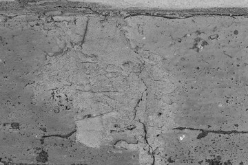 The concrete texture, wall, with cracks and scratches can be used as a  background, web banner with space for text