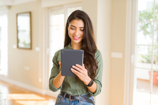 Beautiful young woman working using touchpad tablet