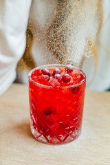 woman drinking cranberry mocktail