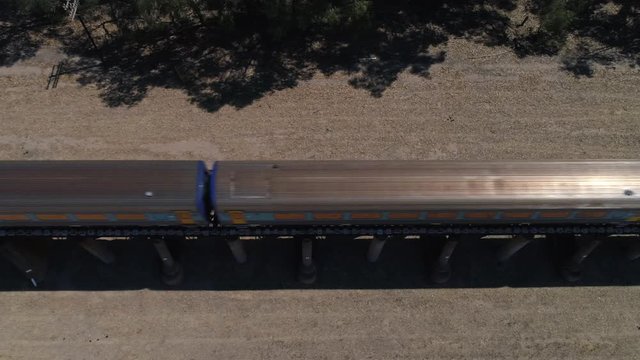 Aerial top down of the XPT passenger train passing through rural Australia
