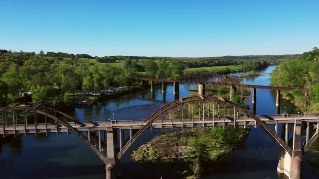 A short clip taken from a drone overlooking the old Cotter Bridge and railroad truss that span the White River in Cotter Arkansas. This area is known for its world class trout fishing.