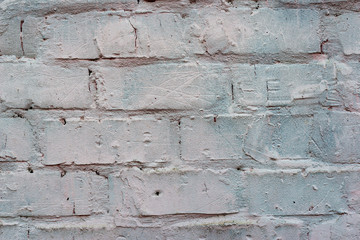 The brick texture, wall, with cracks and scratches can be used as a  background