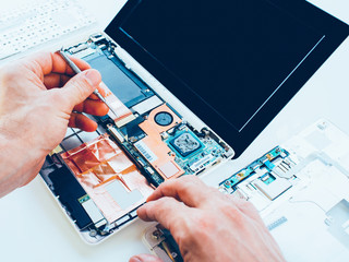 Laptop repair service. PC hardware upgrade and maintenance. Engineer fixing broken notebook....