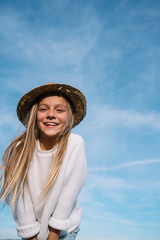 Stylish girl looking at camera with hat